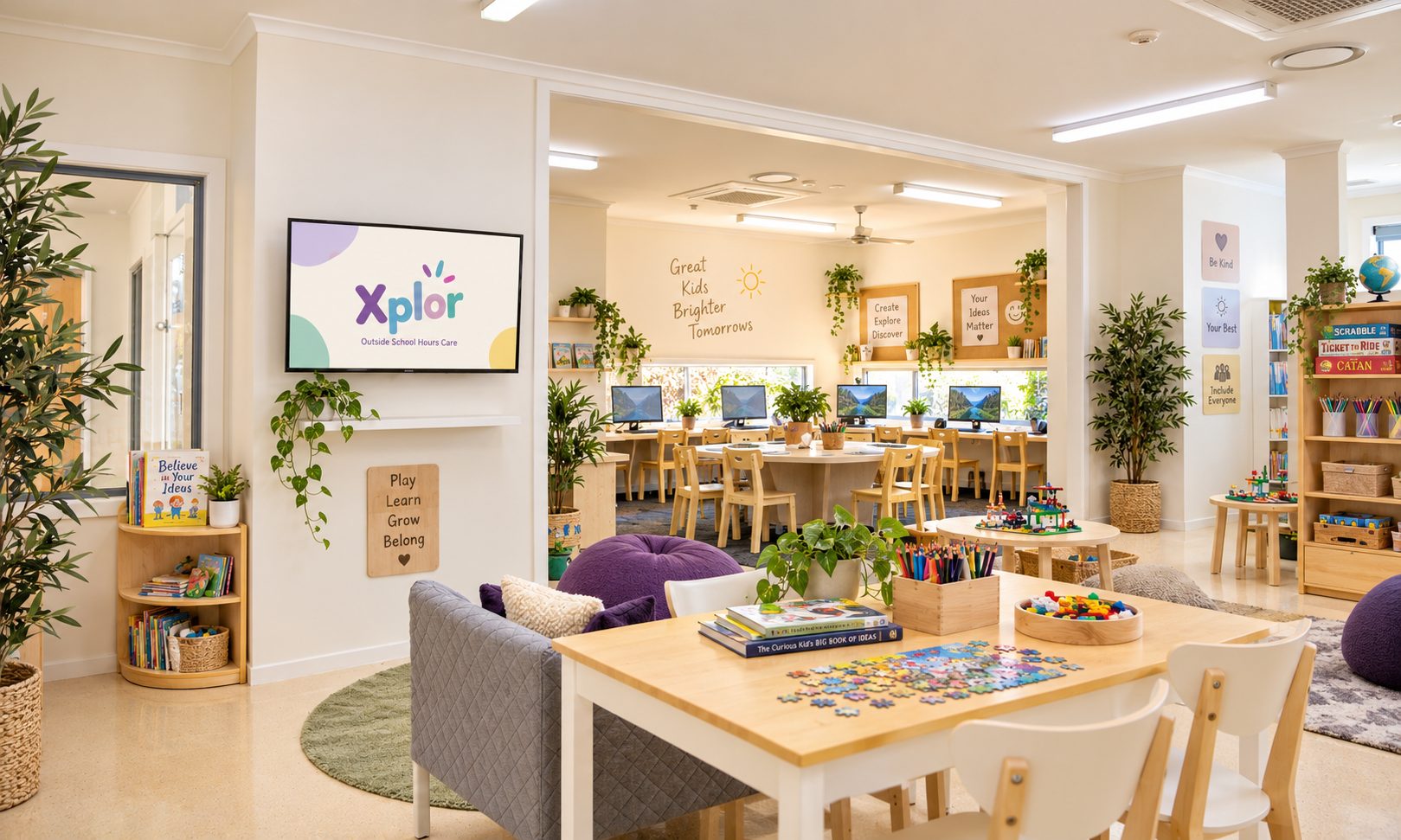 Outside school hours care room at Xplor Coomera with computer desks, bean bags and a large Xplor screen